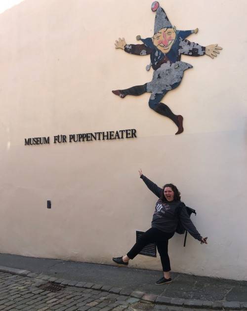 Stephanie Tanis in front of a theater